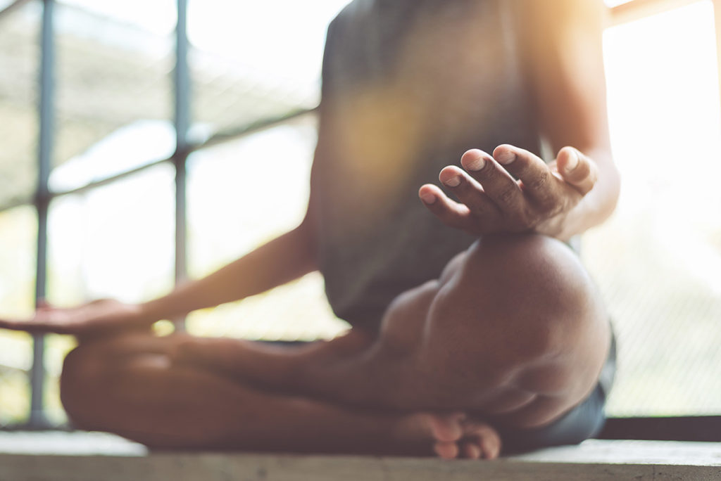 a person practices meditation for depression