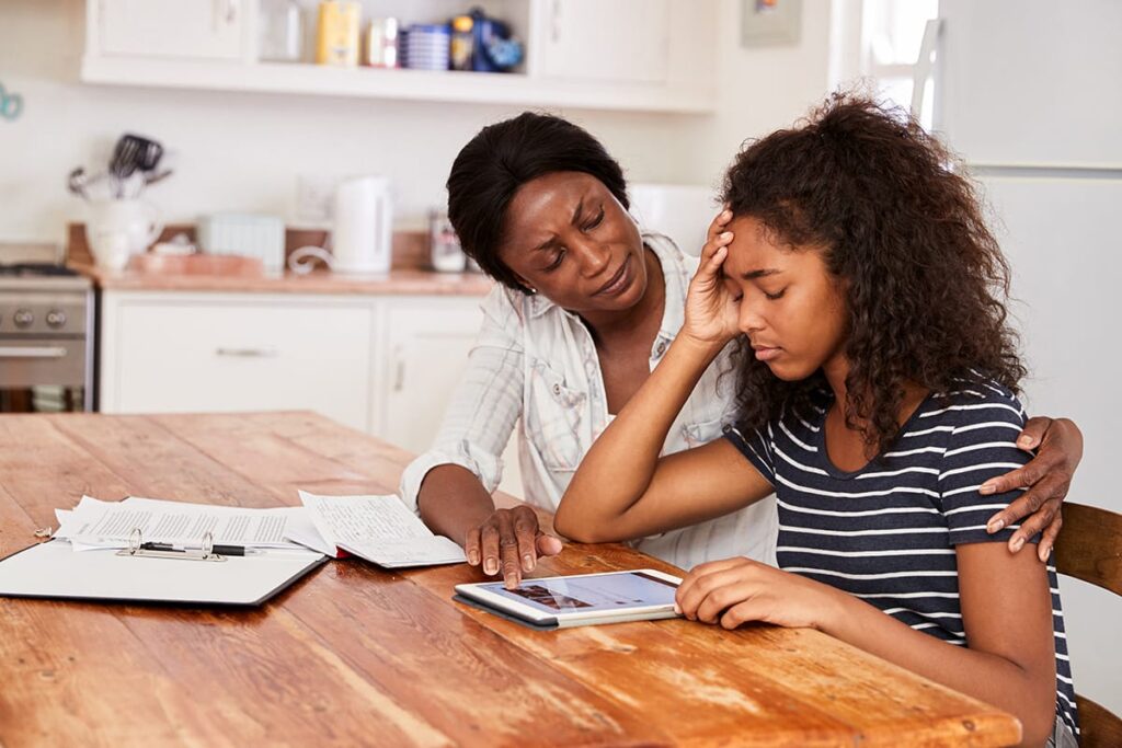 a parent and stressed child interact, potentially dealing with a codependent relationship