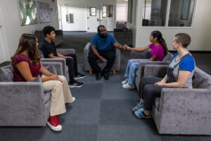 Teens in group therapy session