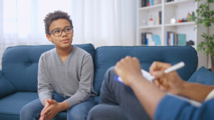a teen works through mental health therapy in a partial hospitalization program