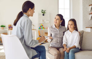 behavioral health specilist explaining to mother and her young daughter what does depression medication do