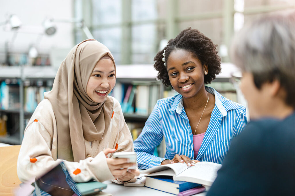 two teenage women talking to a therapist about how residential treatment supports youth mental health and recovery.
