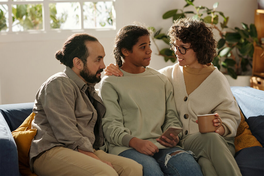 Family talks with adolescents about mental health treatment after understanding insurance coverage for adolescent residential recovery.